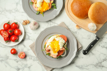 Flat lay composition with tasty brunch served on white marble table