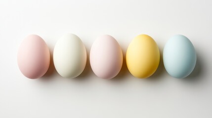 Colorful eggs arranged in a row for spring celebration, highlighting pastel hues and festive ambiance in a minimalistic setting