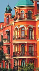 Obraz premium Ornate coral building with arched windows, city background, architectural design, great for travel