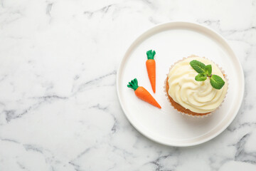 Delicious carrot cupcake with mint on white marble table, top view. Space for text