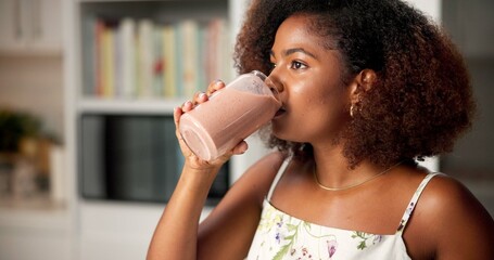 Woman, drinking and healthy smoothie at house for nutrition drink, detox benefits and weight loss...