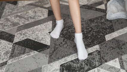 Child girl doing fitness exercises at home in his room