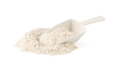 Pile of brown rice flour and scoop isolated on white