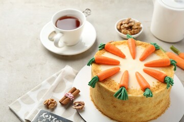 Delicious homemade carrot cake served on light grey table