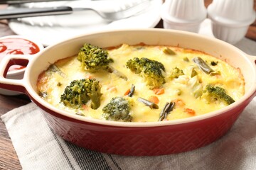 Delicious vegetable casserole on wooden table, closeup