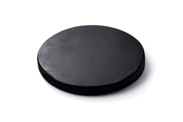 a black round object on a white surface cutout and isolated on transparent background 