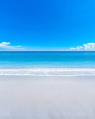 Obraz premium Tranquil beach scene with clear blue sky and calm turquoise water lapping a white sandy shore