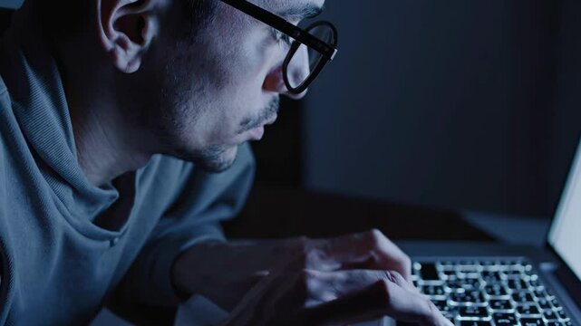 Programmer working late at night on laptop