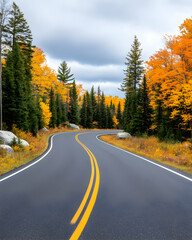 Fototapeta premium Winding road through autumn foliage