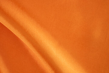 Luxurious Orange Satin Fabric with Smooth and Shiny Finish. Silky background.