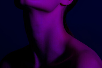 Mysterious female silhouette in purple light