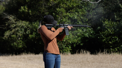 Fototapeta premium Woman Shooting Rifle