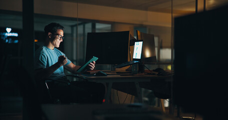 Business, man and celebration with tablet in office for website security success, troubleshooting or UI design. Web developer, person or victory fist for app launch or system update deadline at night