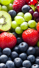Vibrant mix of fresh strawberries, blueberries, raspberries, kiwi, and green grapes