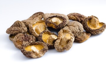 Dried shiitake mushrooms on a white background, showcasing detailed textures and a natural, savory palette.