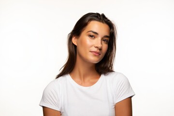 Fototapeta premium A woman wearing a white t-shirt is looking at the camera