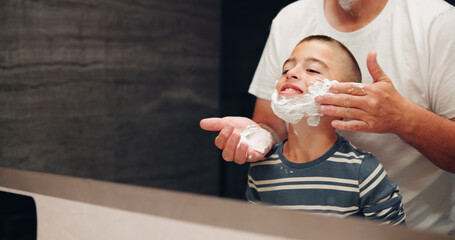 Shaving, child and dad with foam in mirror for teaching skincare, grooming practice and hair...