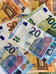 Close-up of various euro banknotes in different denominations. European currency, financial concept, money background, economy, and wealth symbol.