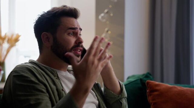 Mad furious Caucasian business man male guy client businessman homeowner talking mobile phone shouting yell complaining quarrel angry complain lateness late delivery order waiting hurry late at home