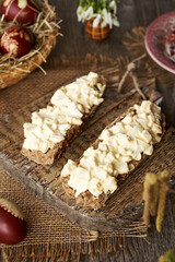 Two slices of bun with bread spread made of leftover Easter eggs