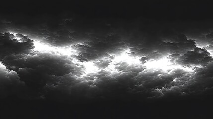 Obraz premium Dark clouds illuminated with bright light from an opening