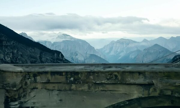empty bridge fragment near the mountains