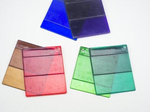 Various colors of clear color chips isolated on white background, color samples of plastic products produced by masterbatch