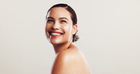 Skincare, beauty and woman in studio with hydration, collagen and natural facial routine. Happy, cosmetic and female person with face dermatology treatment for hyperpigmentation by white background.