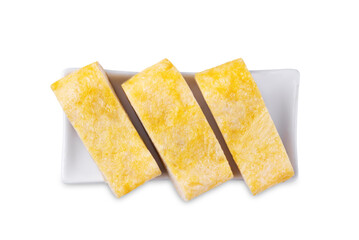 Tamagoyaki, asian omelette roll in a plate on a white isolated background