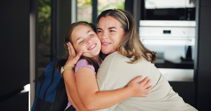 Mother, girl and hug for school in home with goodbye, affection and education support. Morning routine, woman or kid with backpack for greeting, embrace and leaving with learning preparation or love
