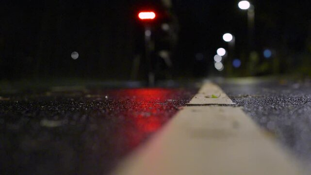Bicycle travelling on a bike road at night