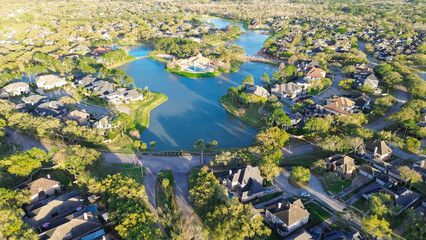 Entrance to upscale lakeside gated residential neighborhood along Eldridge Parkway unincorporated area community northwestern Harris County, Houston, expensive mansion home with pools, aerial