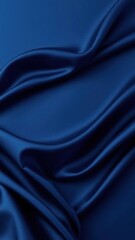 Fototapeta premium Navy blue elegant abstract background. Silk satin fabric with nice folds. Beautiful dark blue background with wavy lines. Copy space.