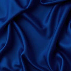 Fototapeta premium Navy blue elegant abstract background. Silk satin fabric with nice folds. Beautiful dark blue background with wavy lines. Copy space.