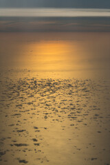 A bird's-eye view of the sunset over the Mediterranean Sea. Aerial photography. View from the airplane window. We look at the clouds from above.