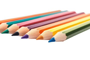 Fototapeta premium Colorful array of vibrant pencils aligned on white surface, cut out