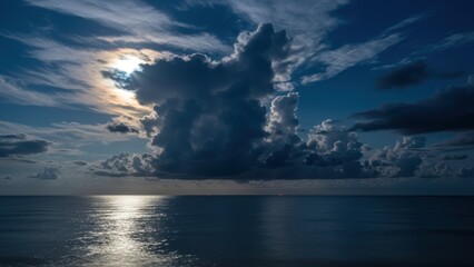 Night scene with a full moon illuminating the sea and casting shadows.