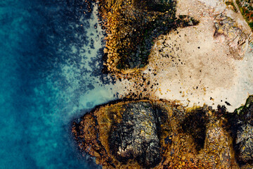 Aerial View of the Rugged Irish Coastline in Howth, Dublin – Rocky Cliffs and Blue Sea