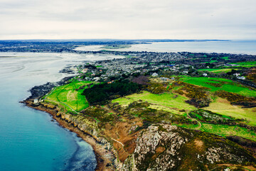 Aerial Drone View of the Irish Rocky Coastline With Martello Tower in Howth – Cliffs, Blue Sea and Lush Greenery