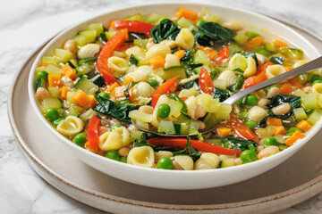Vegetarian Minestrone with in white bowl, top view