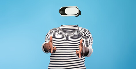 A person engages with virtual reality technology while wearing a headset. The individual has no...