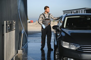 Portrait of a car wash station worker.