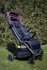 Foldable summer stroller with small wheels.
