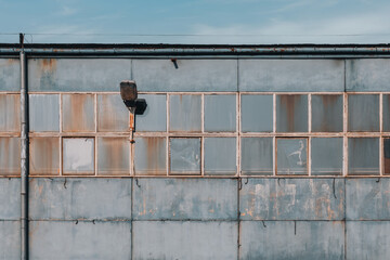 Abandoned Industrial Warehouse with Rusted Metal Windows