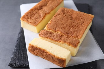 Tasty Japanese Castella sponge cake on grey table, closeup