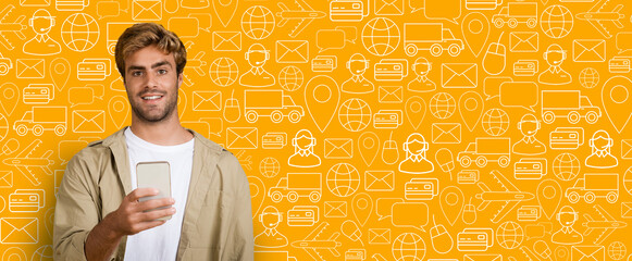 A young man stands with a smartphone in hand, engaging in online shopping. The vibrant background...