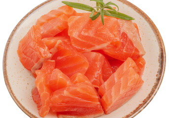 Salmon fish in pieces in a pink plate with rosemary isolated on white.