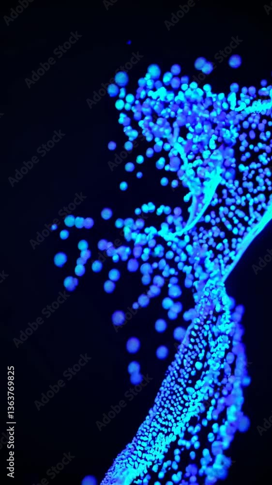 Poster abstract video concept with glowing blue particles resembling a digital wave. captured from a low-an
