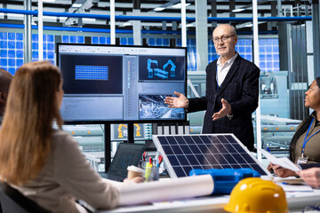 Photovoltaics plant executives analyze green energy manufacturing industrial equipment. Solar...