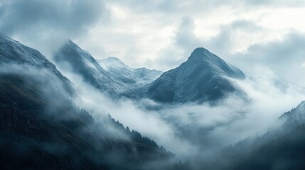 Obraz premium image captures peaceful and ethereal essence of a mountainous scenery enveloped in mist during early hours of day.